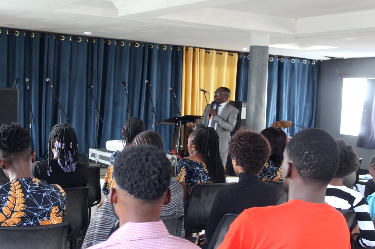 The congregation standing in worship on a Sunday
